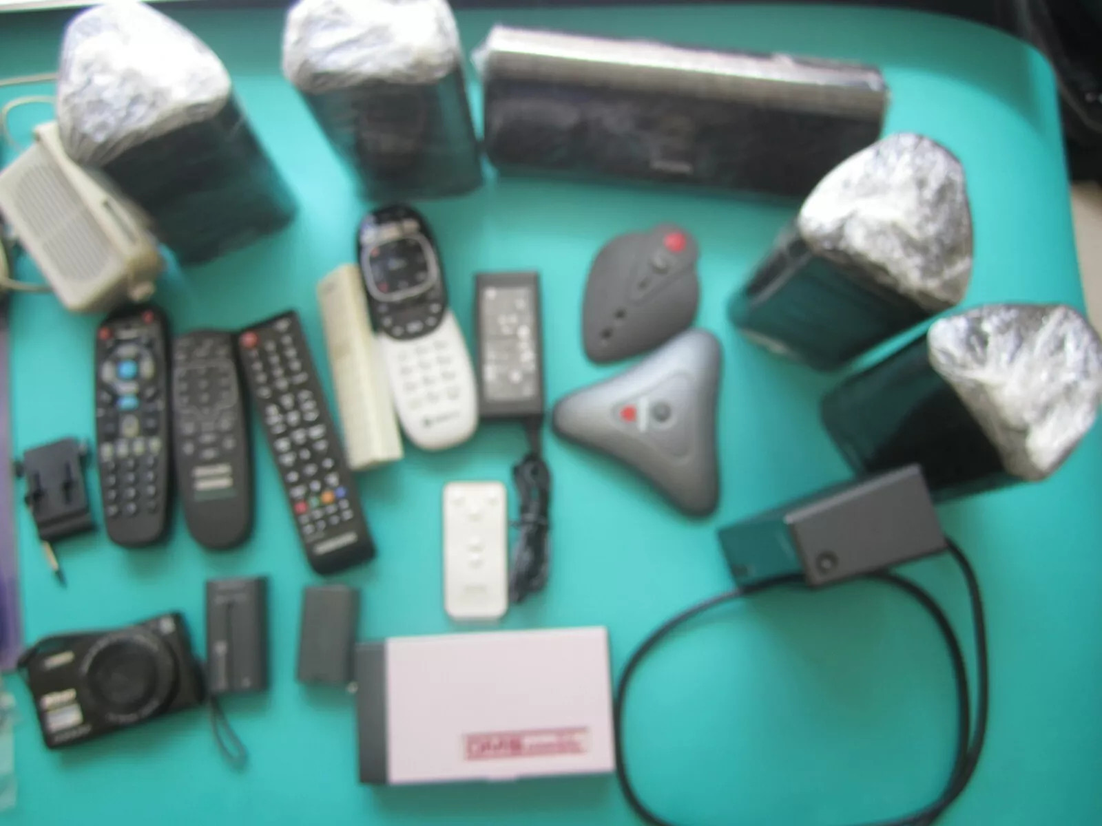 Mixed Lot of Electronics speakers, remote controls, batteries, and more W