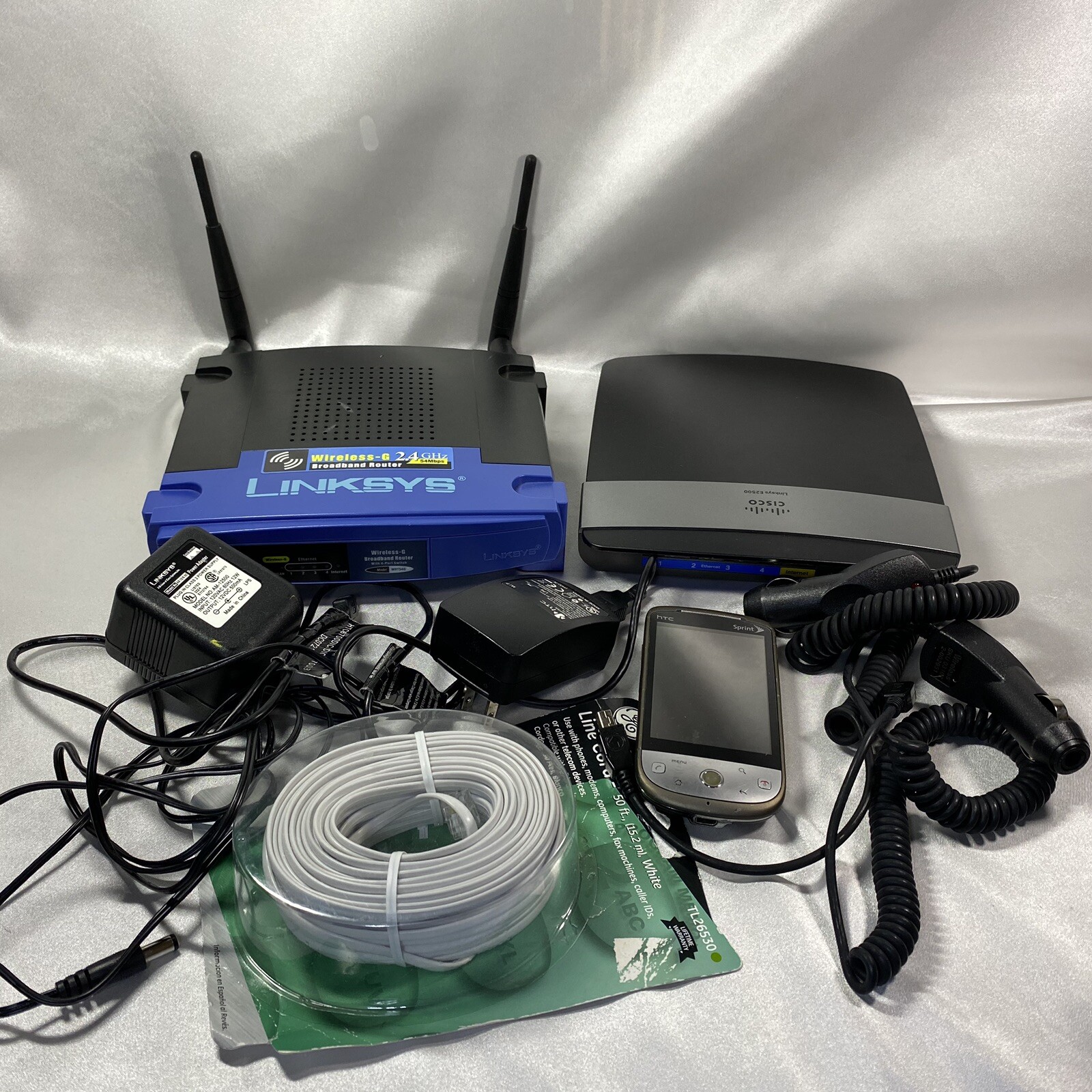 Junk Drawer Electronics Lot Linksys Router HTC Cell Phone Chargers Battery More