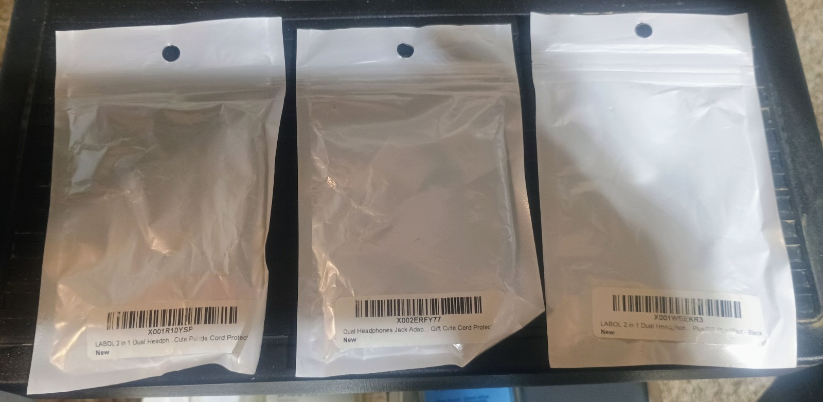 iPhone chargers, adapters, case, earbuds, and a mini display port to HDMI