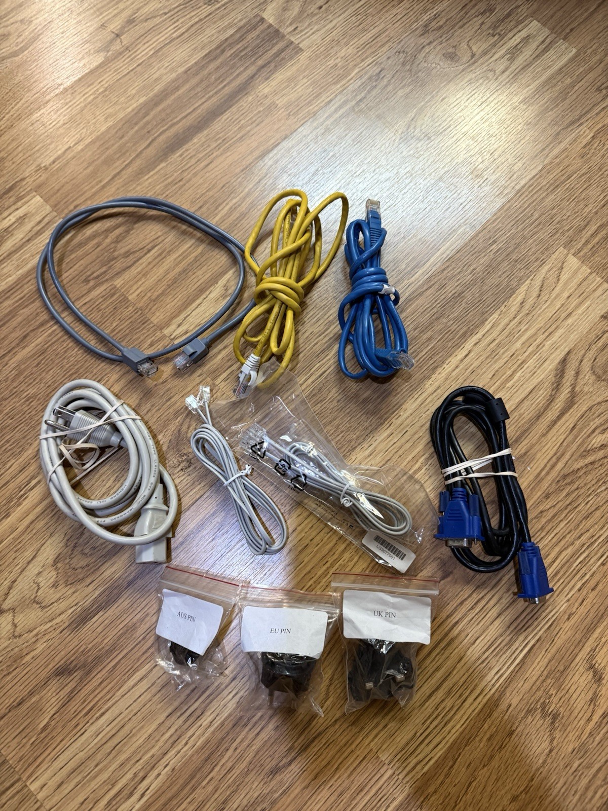 Assorted Computer Cables And International Adapters