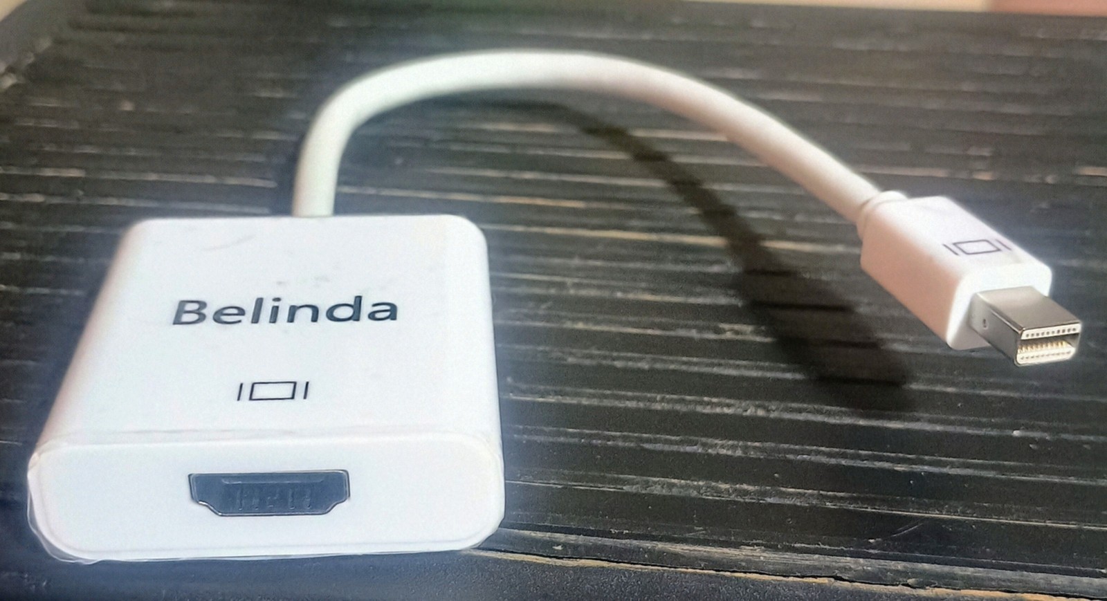 iPhone chargers, adapters, case, earbuds, and a mini display port to HDMI