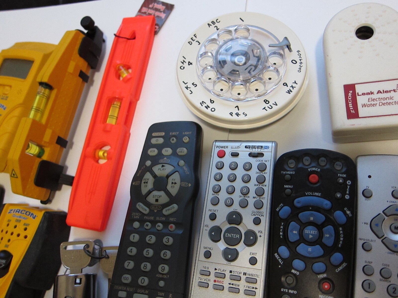 Mixed Lot of Electronics, remotes, Stud finder and more. T