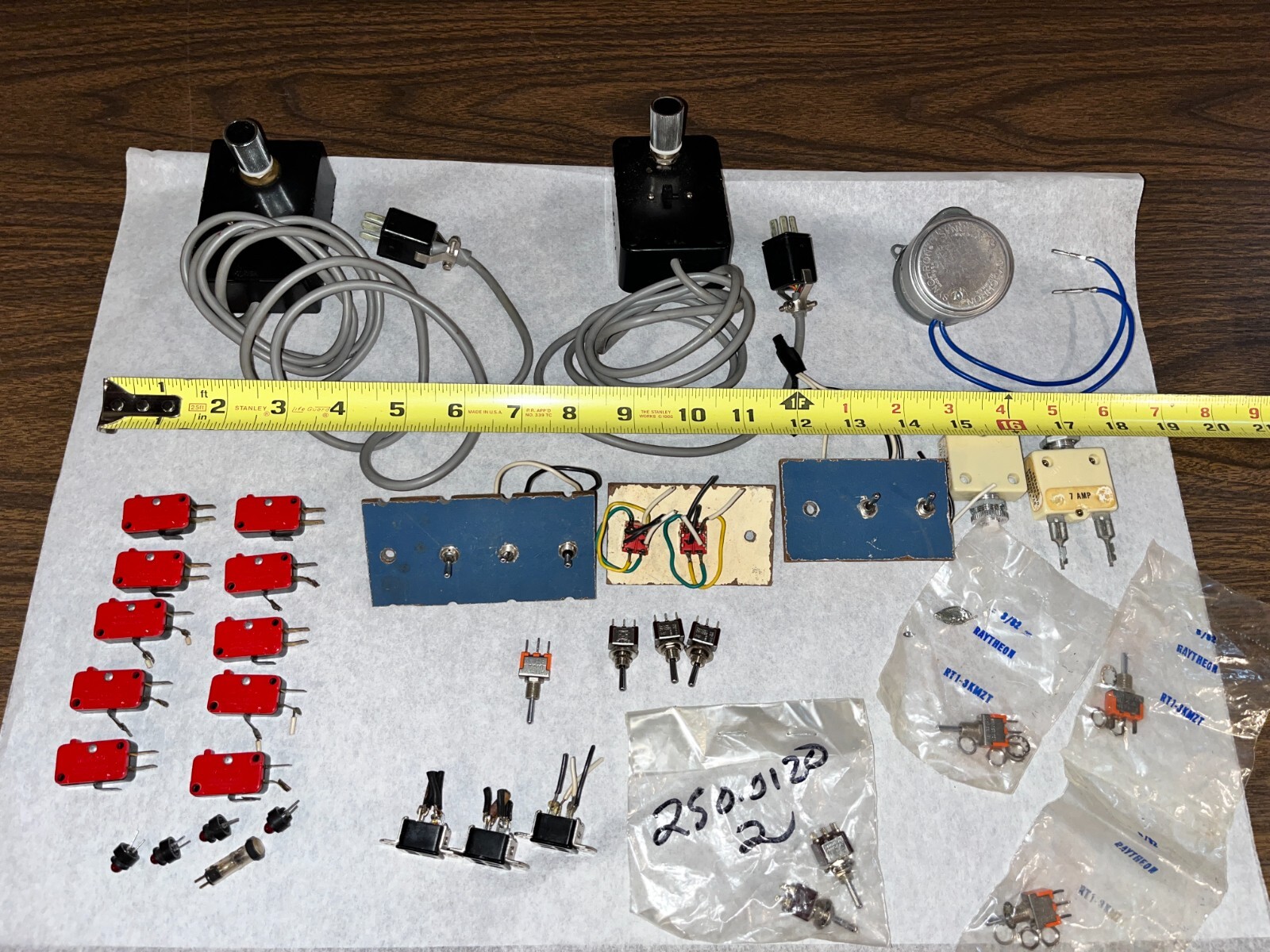 Lot of electronics. Synchron elec. Clock motor, micro switches and toggles, etc