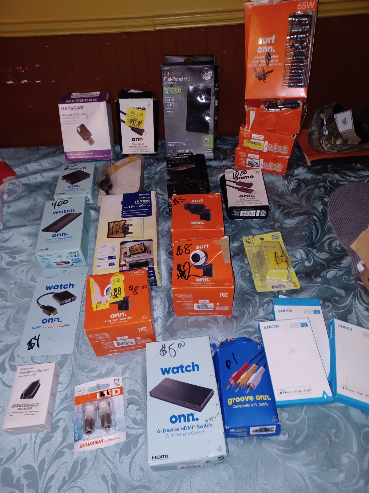 Variety Of Opened And New Electronics Batteries Phones Cases And Ect