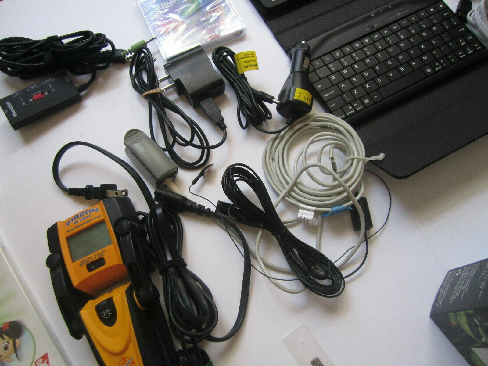 Mixed Lot of Electronics, remotes, Logitech receivers, PSP Games and more.. H