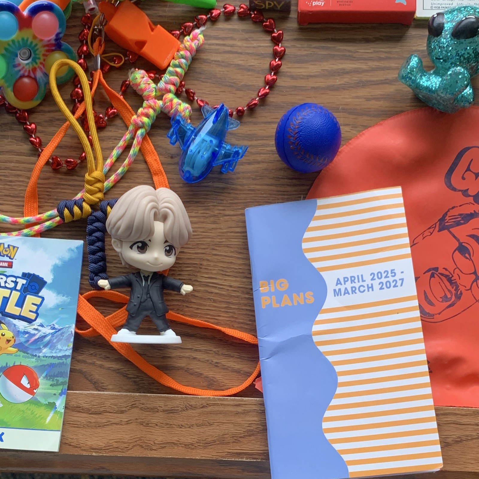 miscellaneous items including USB Wall Charger, card games, planner, yo yo, toys