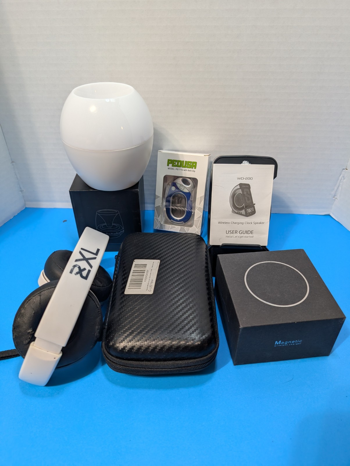 electronics lot. digital clock,bt earphones & speakers, magnetic charger, scope