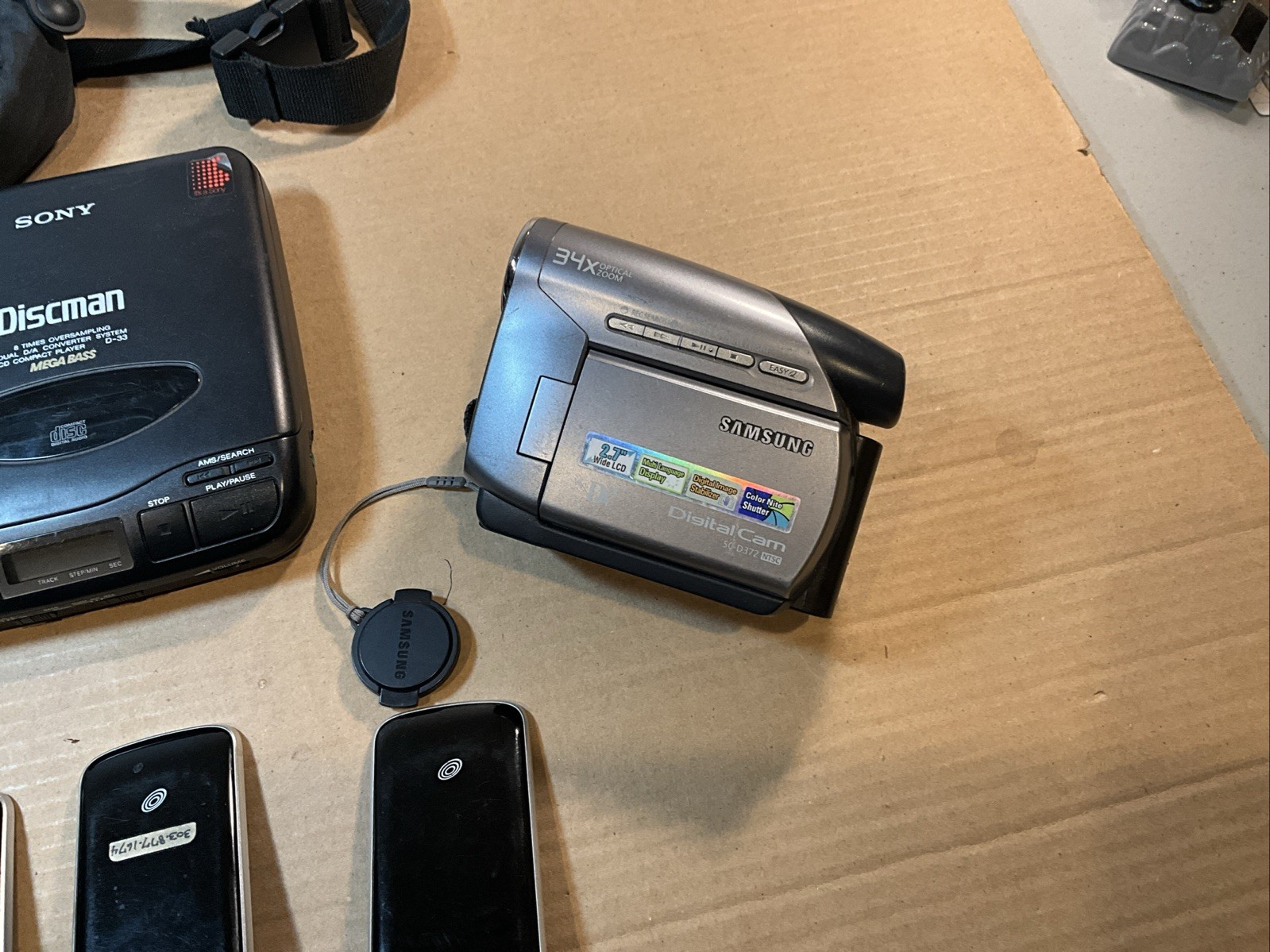 Vintage Electronic Lot- Trac Phones, Cam Corder, Walkmans And Spirit 600 Camera