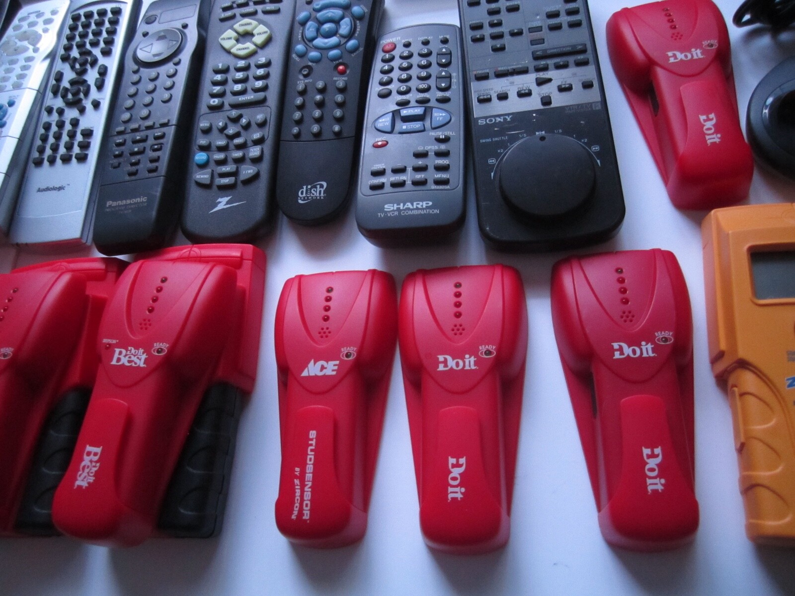 Mixed Lot of Electronics, remotes, Stud finder and more. S