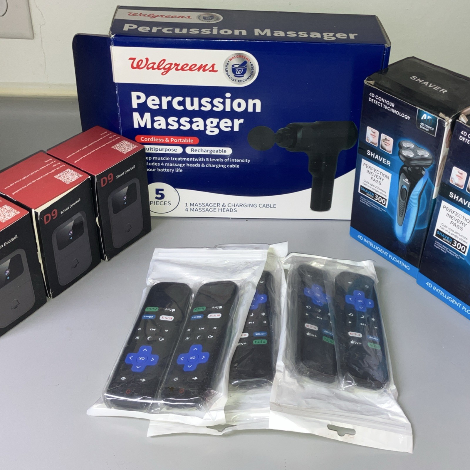 Electronics lot 3 shavers 5 Roku tv remotes 3 D9 doorbell WiFi cameras + massage