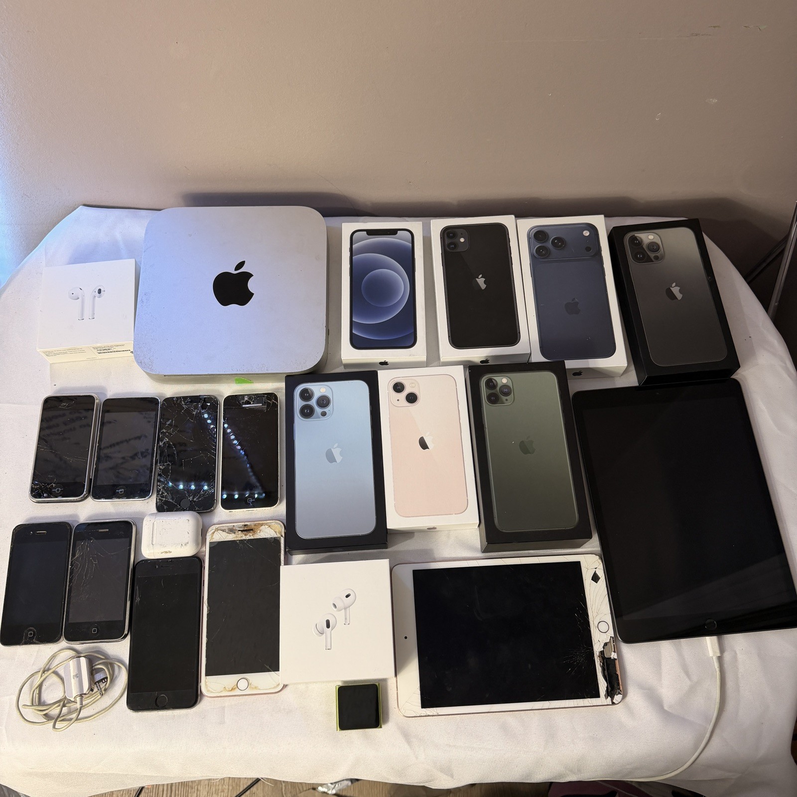 Apple products lot (28 items) Iphones, Mini Mac, tablet, boxes, accessories more