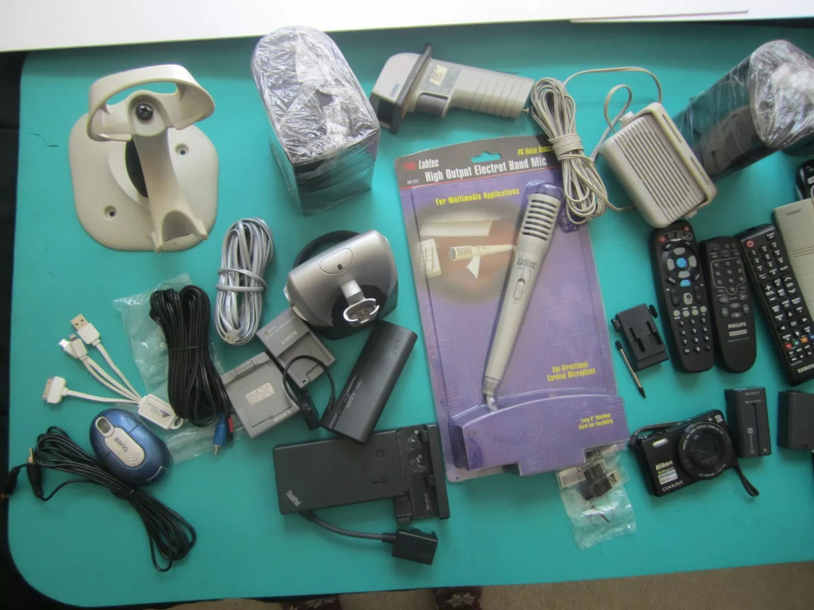 Mixed Lot of Electronics speakers, remote controls, batteries, and more W