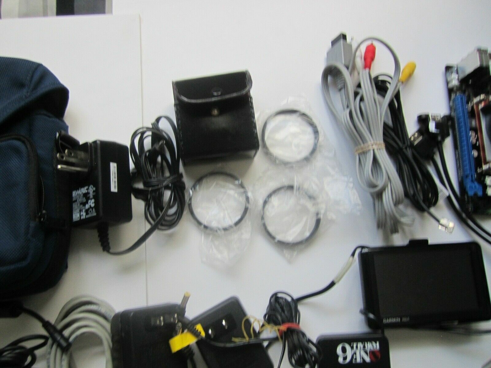 Mixed Lot of Electronics, remotes, AC Adapters, GPS & more….. NO RETURNS M