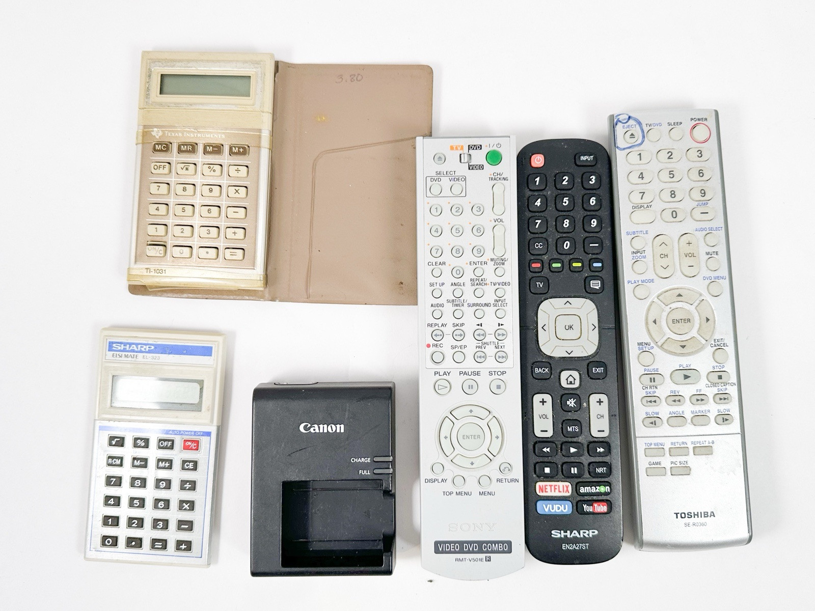 Mixed Electronics Lot TV Remotes Camera Calculators Vintage