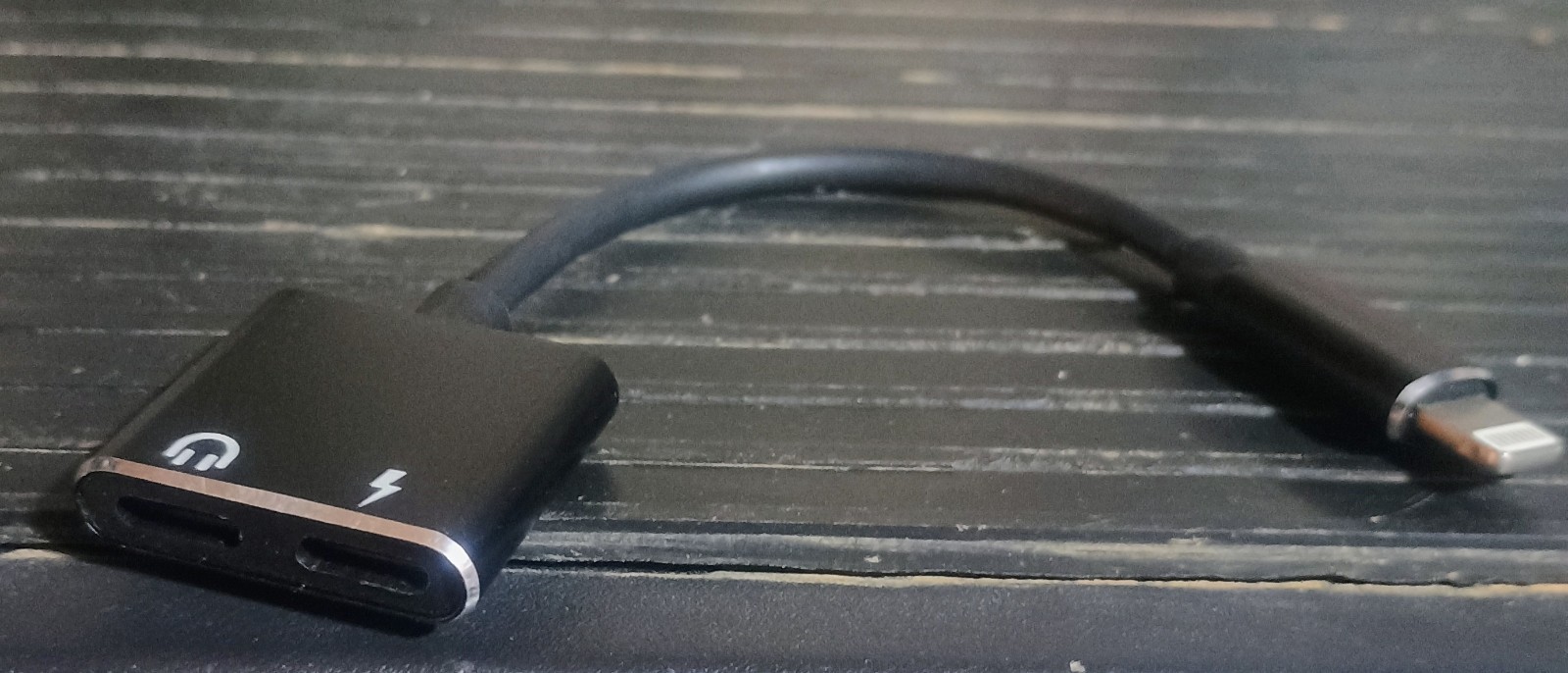 iPhone chargers, adapters, case, earbuds, and a mini display port to HDMI