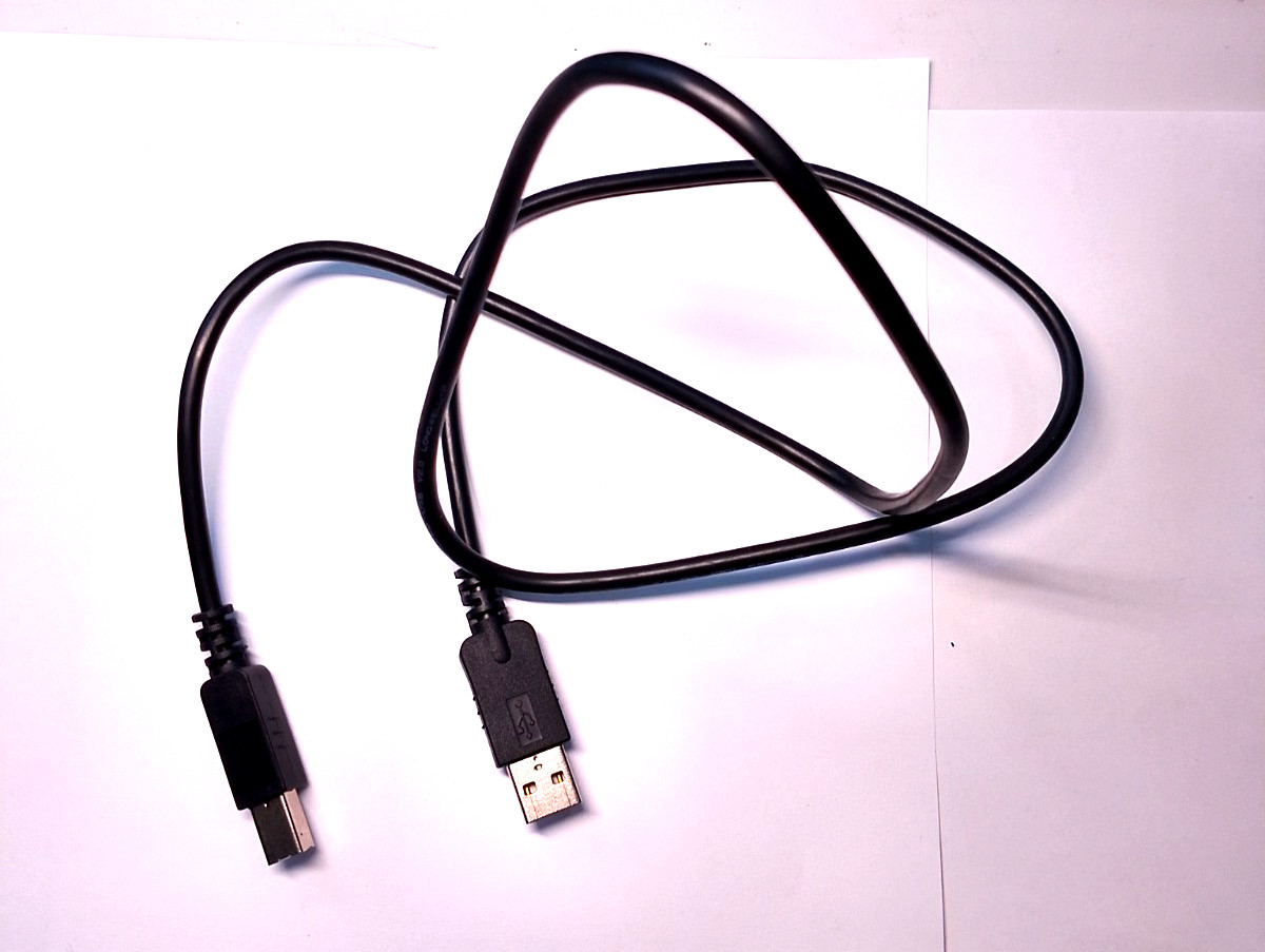 Spare untested cord lot and headphone lot with black bag
