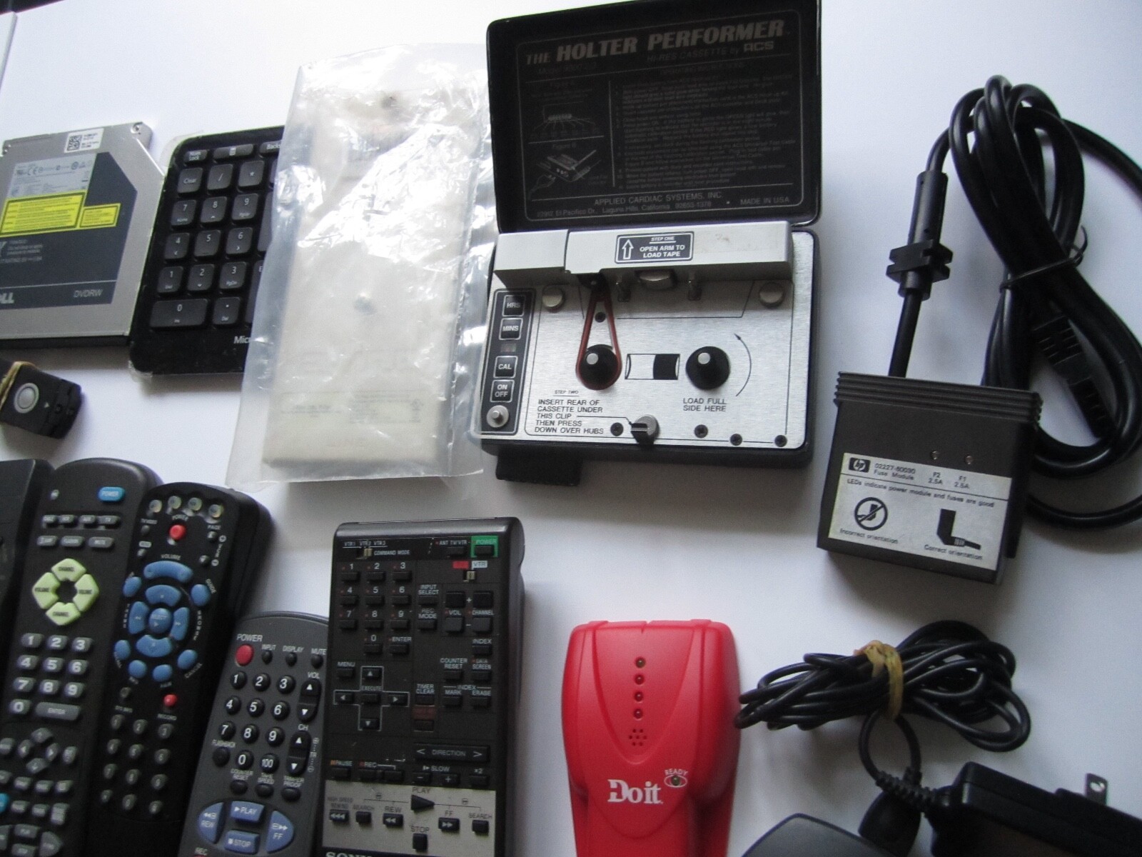 Mixed Lot of Electronics, remotes, Stud finder and more. S