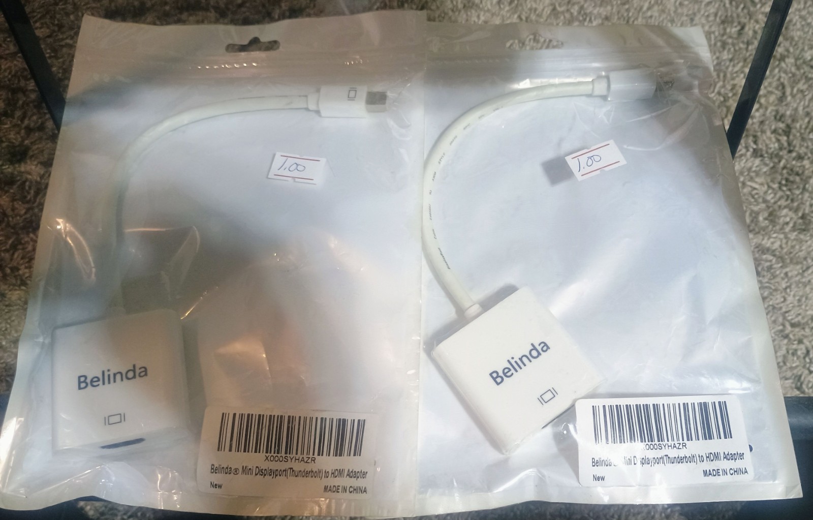 iPhone chargers, adapters, case, earbuds, and a mini display port to HDMI