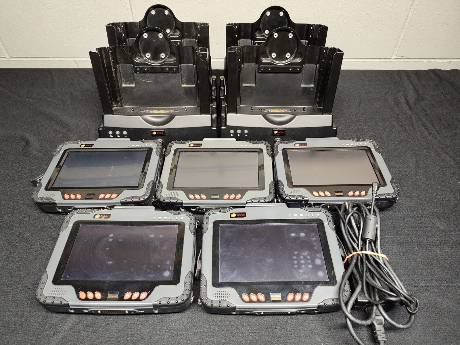 Mixed Lot of 5 DLI 8800 Tablets and 4 Charging Cradles