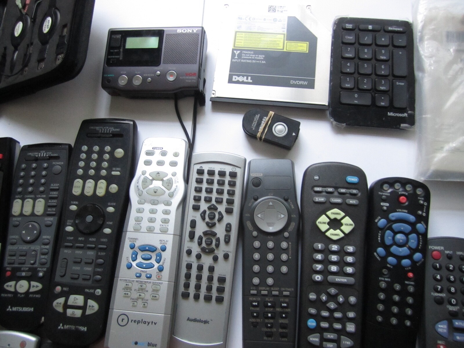 Mixed Lot of Electronics, remotes, Stud finder and more. S