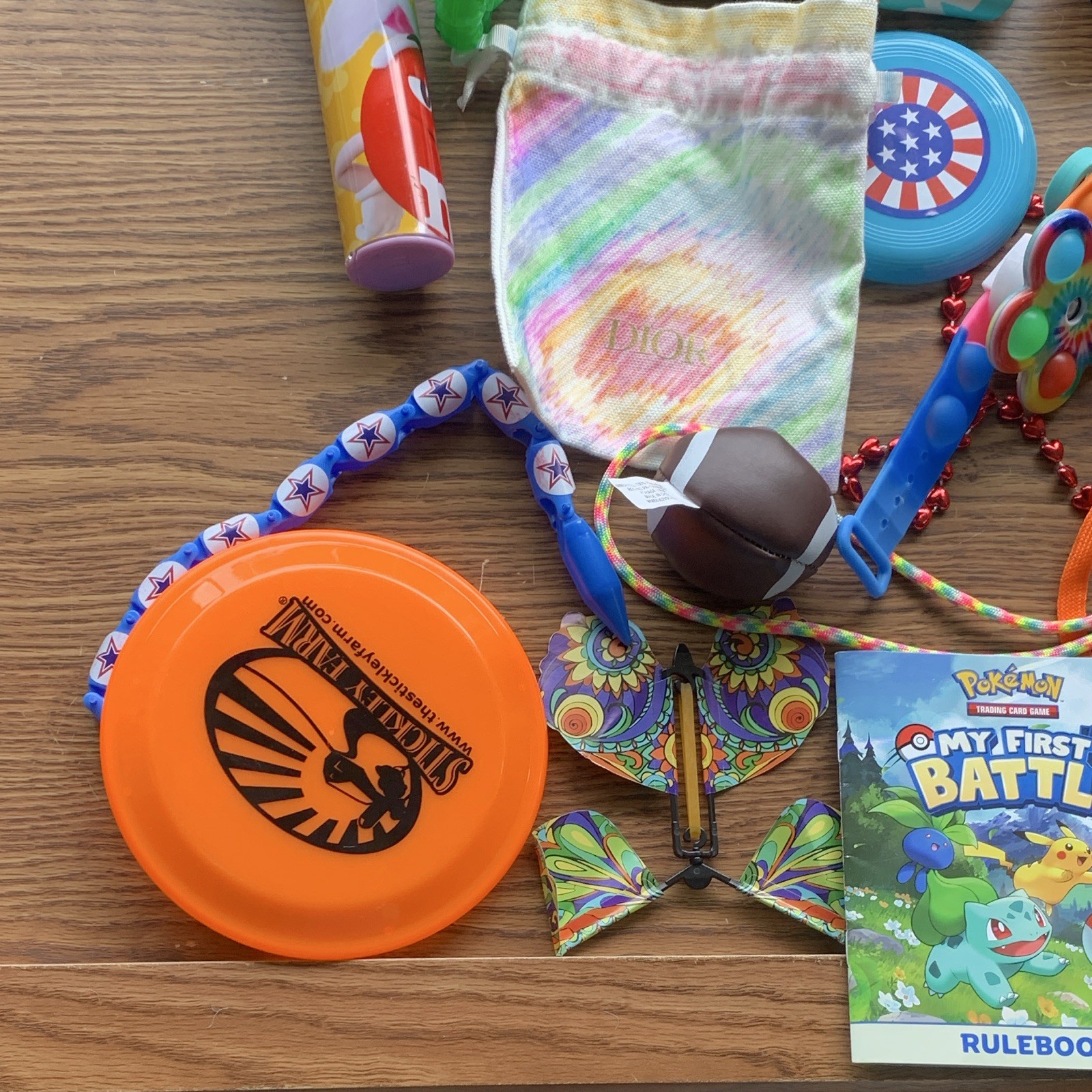 miscellaneous items including USB Wall Charger, card games, planner, yo yo, toys