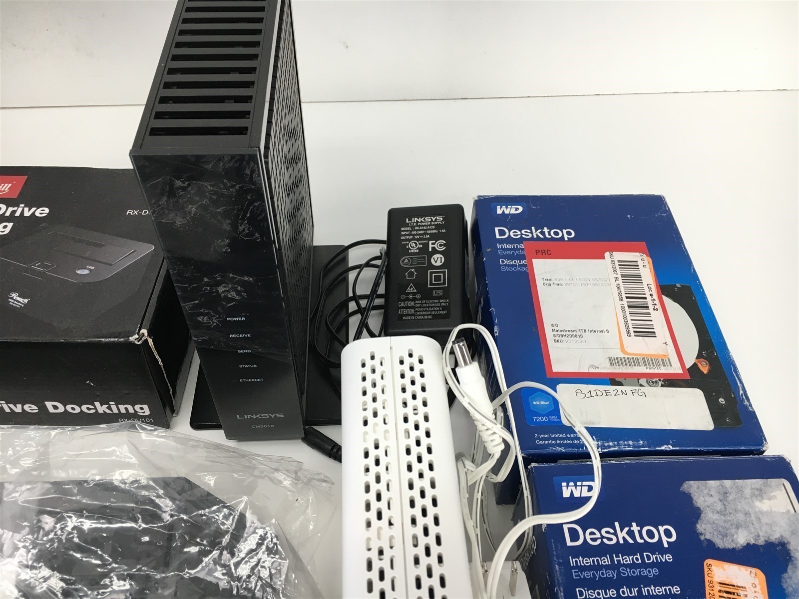 Lot of Headphones Hard Drive Wifi Modem by Linksys Rosewill WD Digipower & More