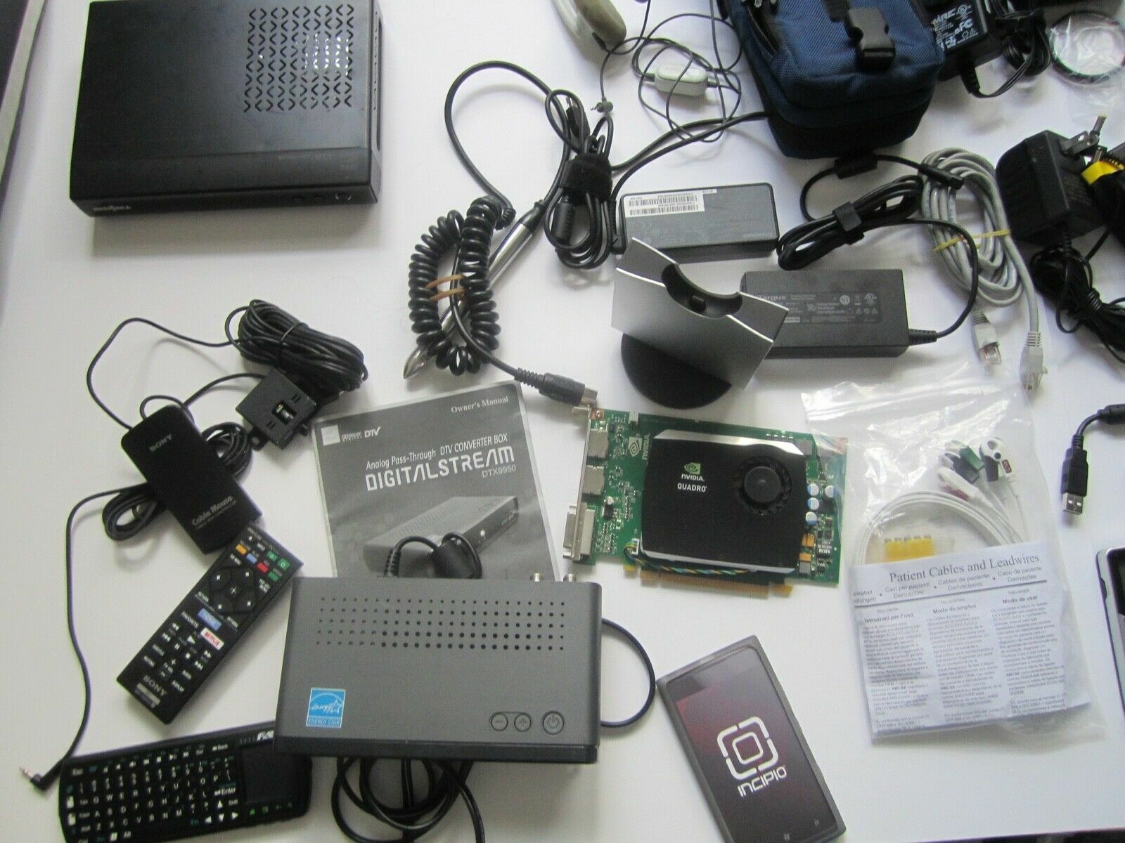 Mixed Lot of Electronics, remotes, AC Adapters, GPS & more….. NO RETURNS M
