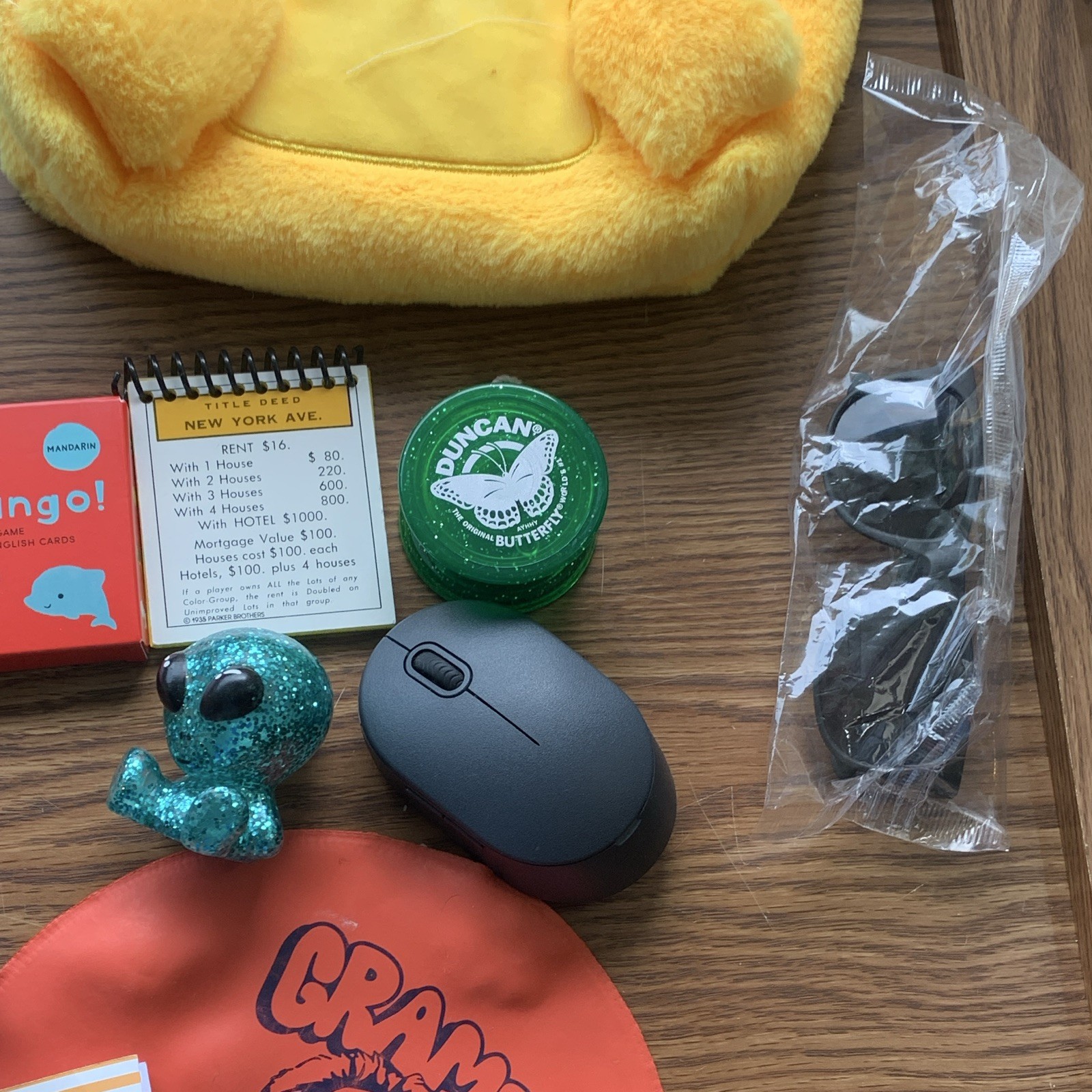 miscellaneous items including USB Wall Charger, card games, planner, yo yo, toys