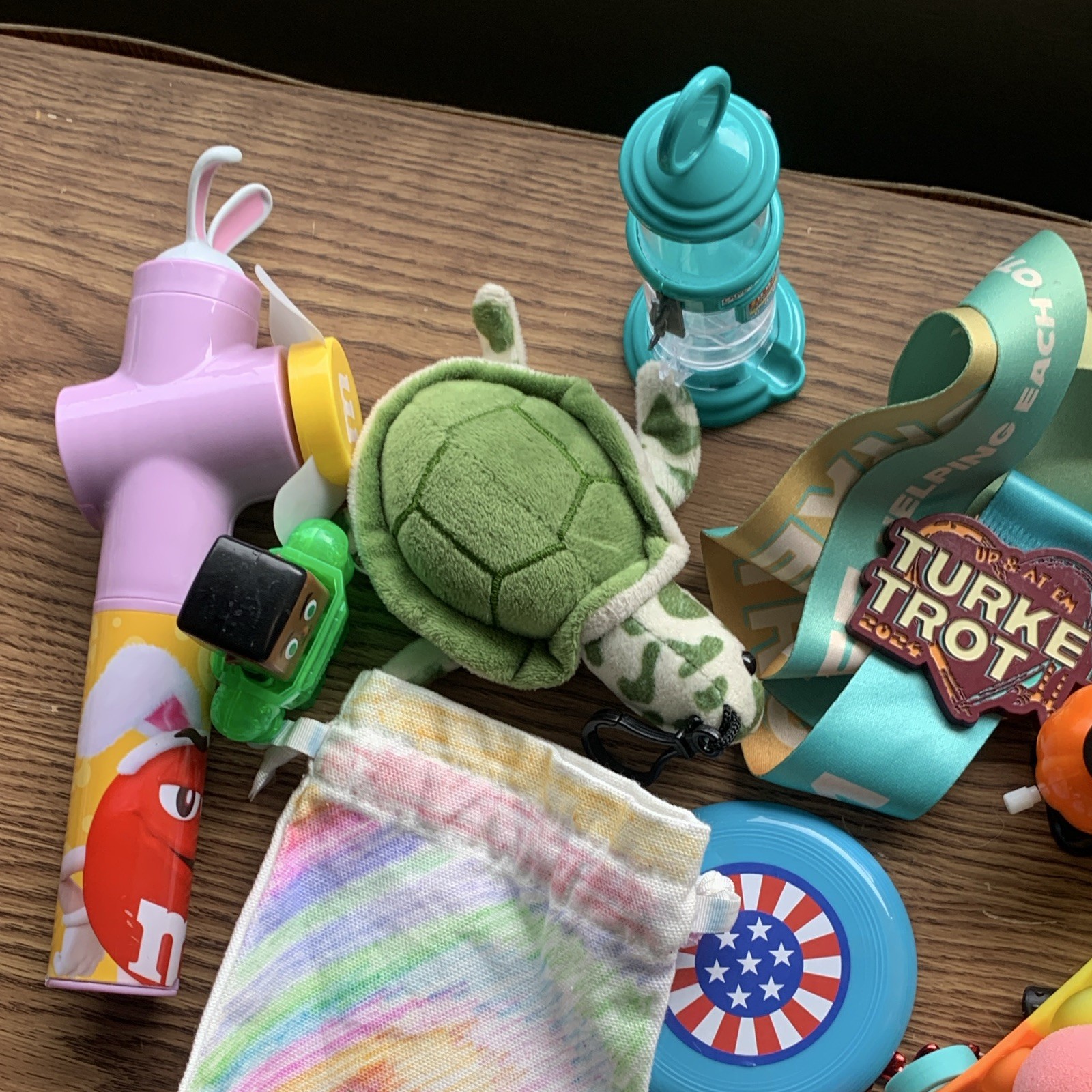 miscellaneous items including USB Wall Charger, card games, planner, yo yo, toys