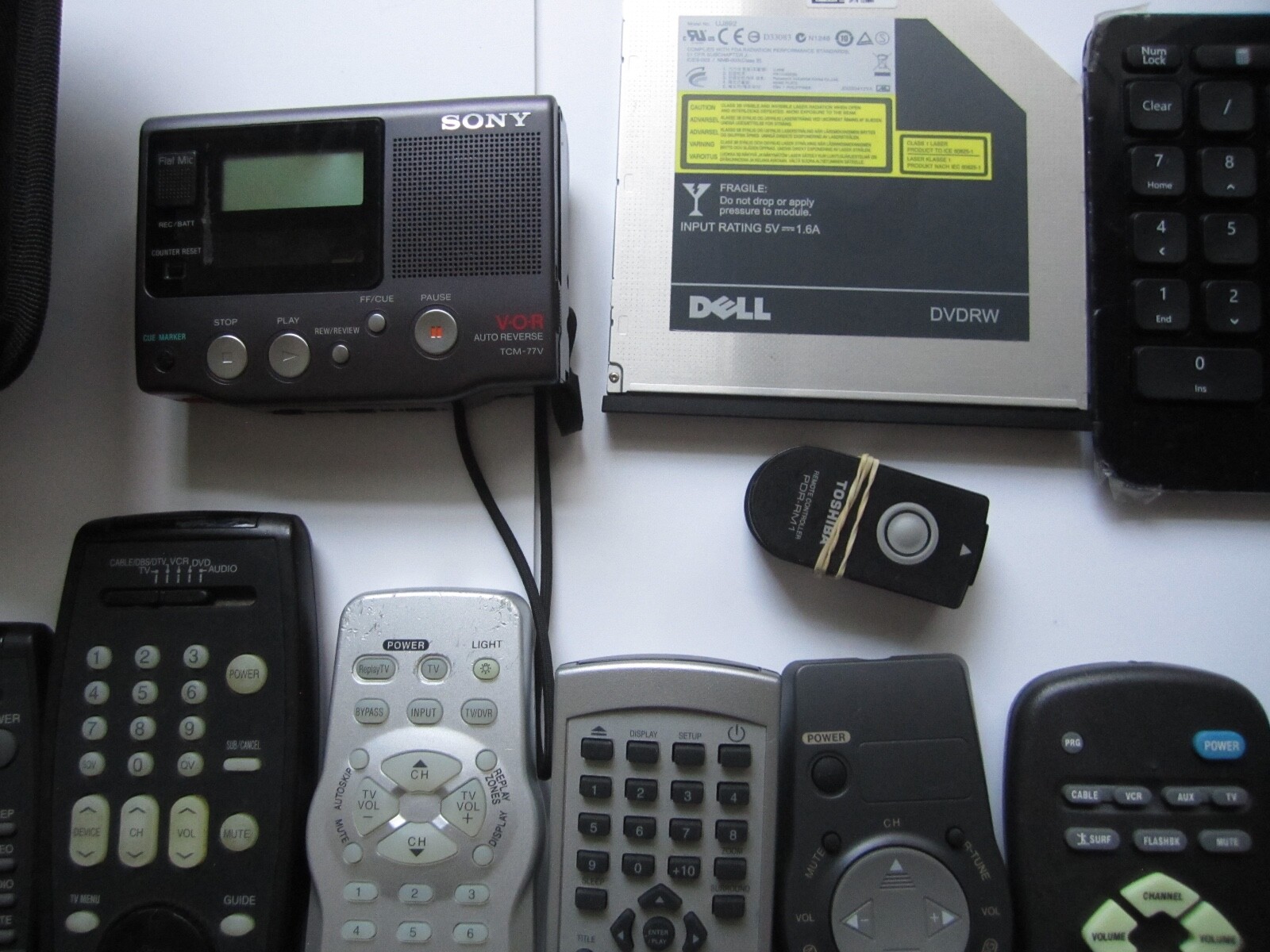 Mixed Lot of Electronics, remotes, Stud finder and more. S