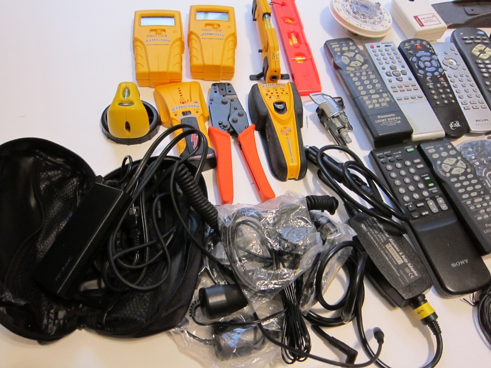 Mixed Lot of Electronics, remotes, Stud finder and more. T