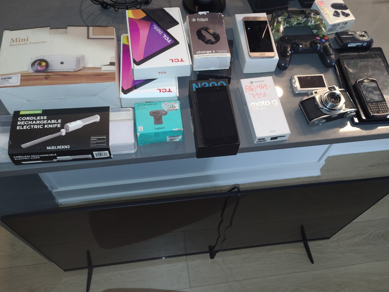 TCL Logitech Motorola Mixed Lot TVs Smartphones Cameras Bluetooth HD Webcam