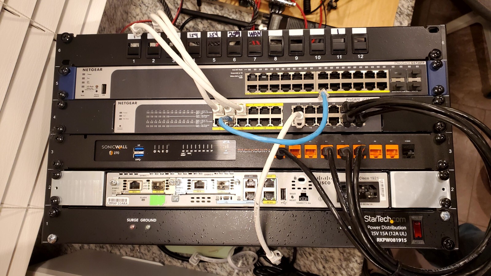 Sonic Wall and Netgear Switches with PDU and Network Rack.