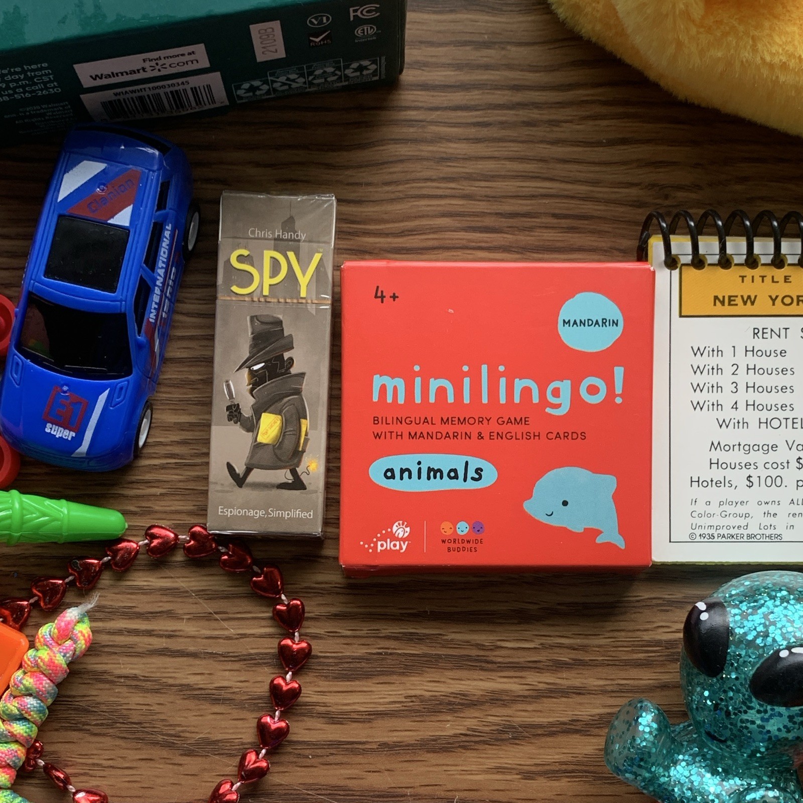 miscellaneous items including USB Wall Charger, card games, planner, yo yo, toys