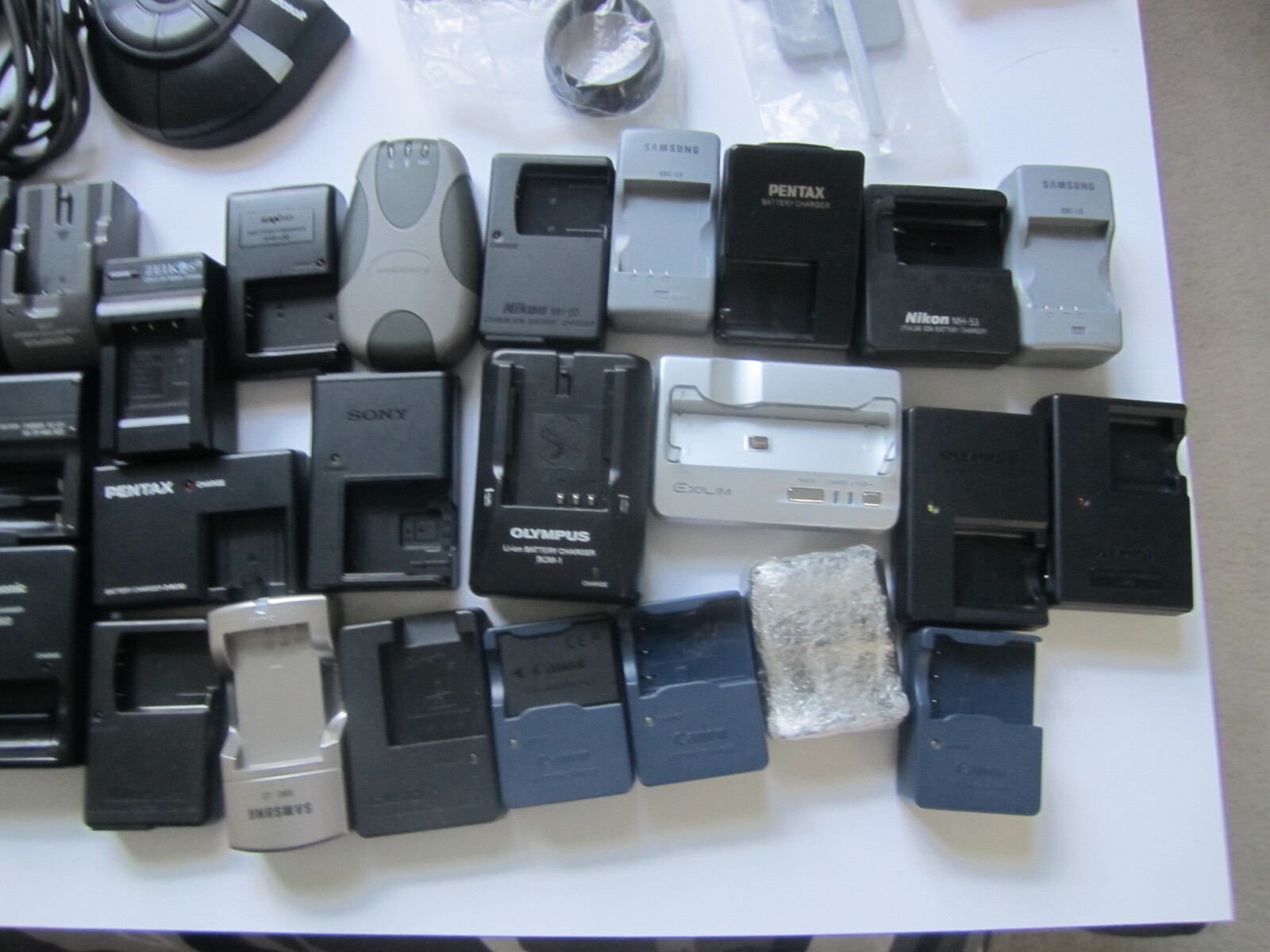 Mixed Lot of Electronics, remotes, battery chargers etc. X