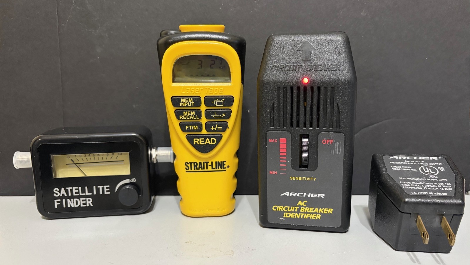 SMALL TOOL PACKAGE. SATELLITE FINDER, STRAIT LINE LASER TAPE , BREAKER ID.
