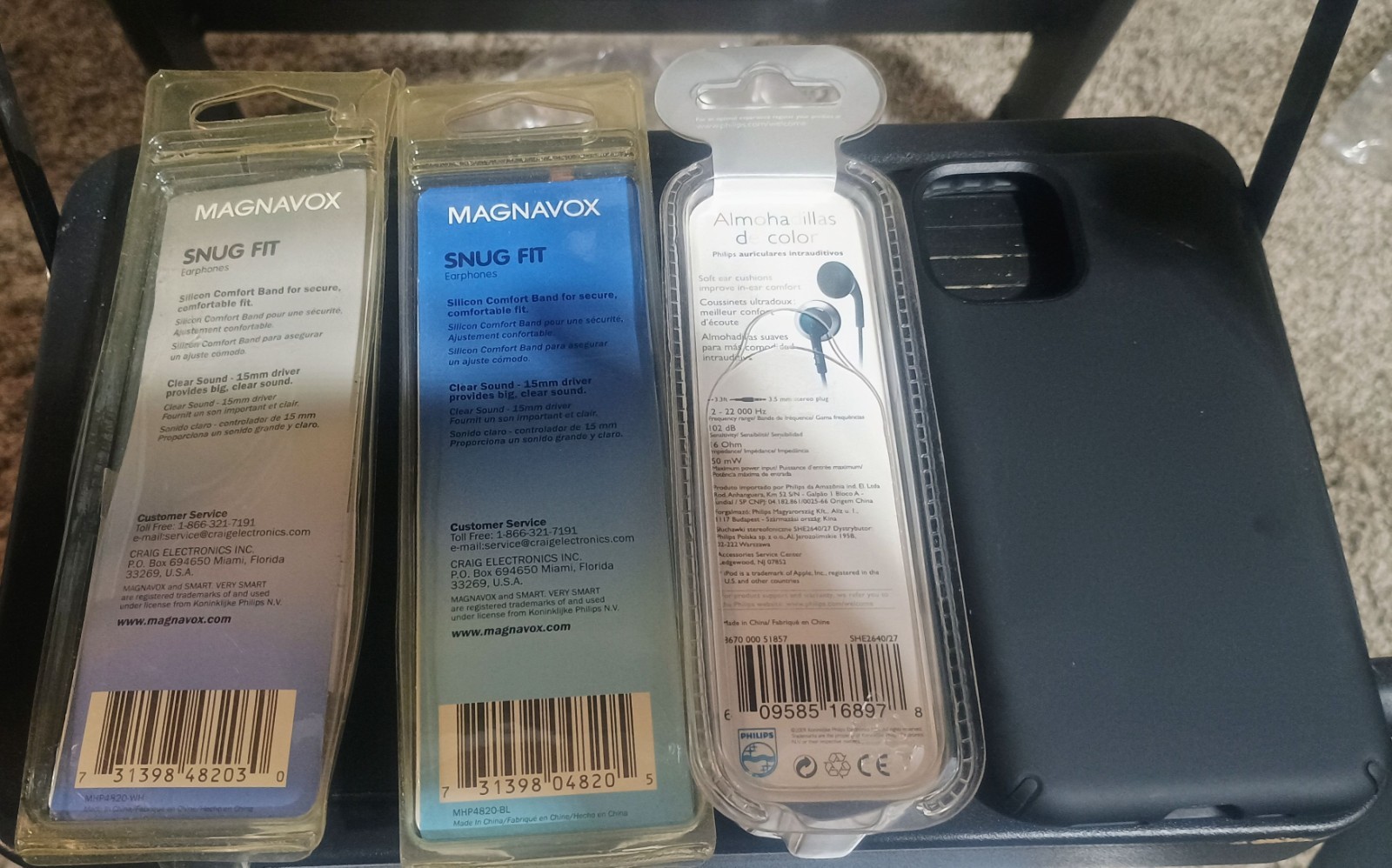 iPhone chargers, adapters, case, earbuds, and a mini display port to HDMI