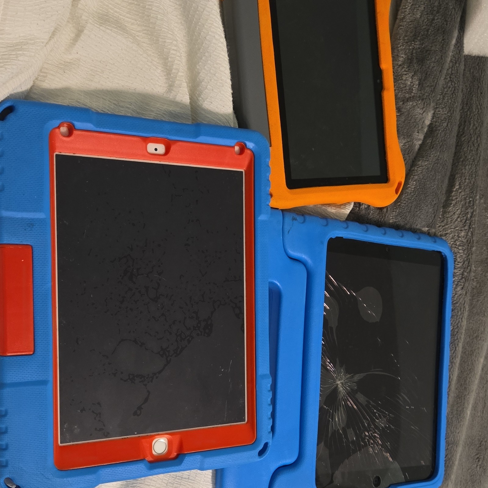 Lot of 3 Tablets – 2 Apple iPads + Amazon Fire Tablet – With Chargers & Cases