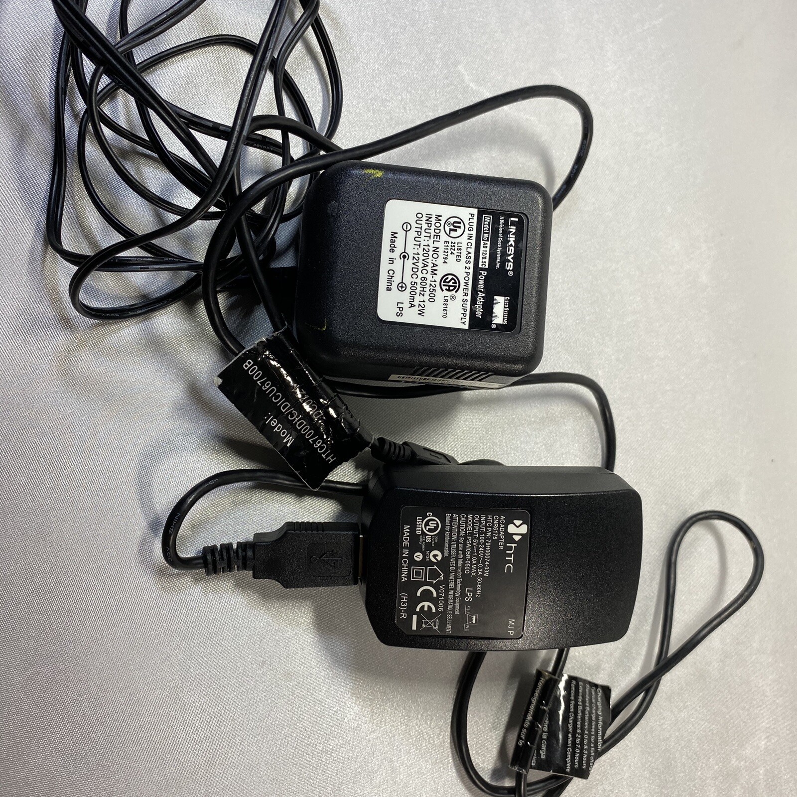 Junk Drawer Electronics Lot Linksys Router HTC Cell Phone Chargers Battery More