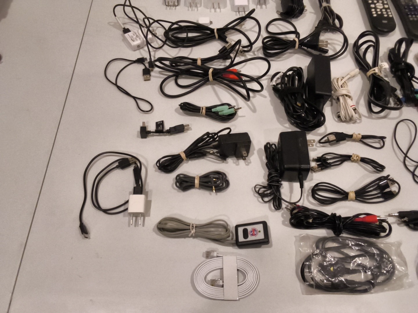 Huge Lot Of Electronic Chargers, Cables, And Remotes