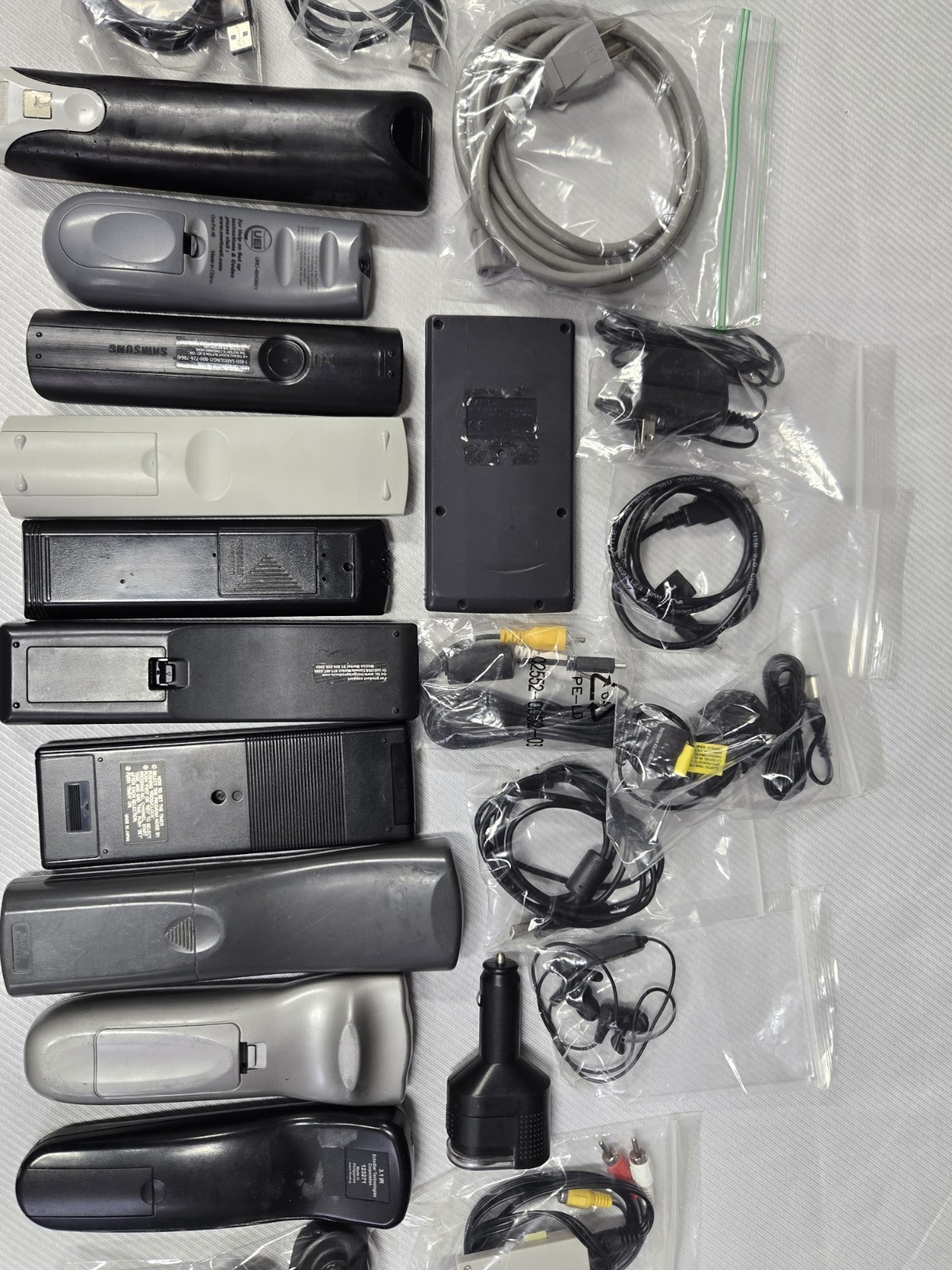 Mixed Electronics Lot Of 24 REMOTE CONTROLS, CABLES, ADAPTERS, Etc. Over 4 Lbs