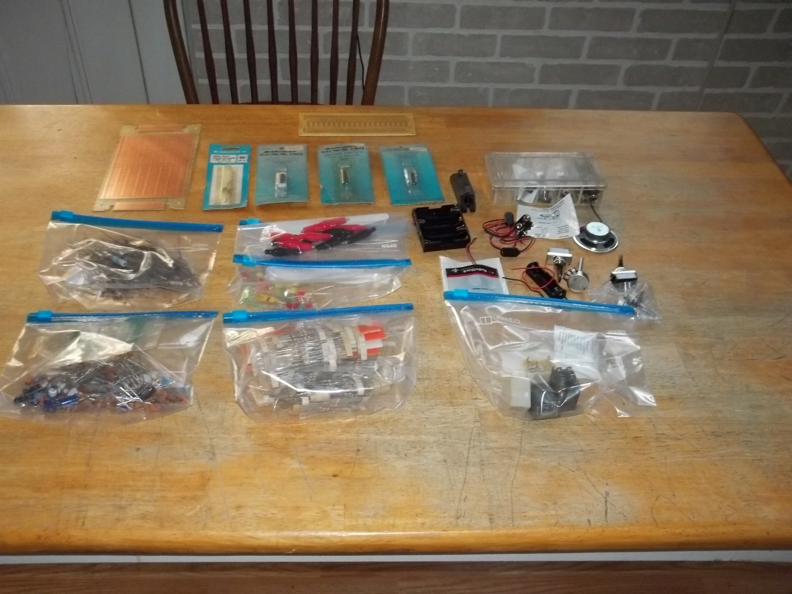 lot of electronics components, resistors, capacitors, relays, transistors, etc.