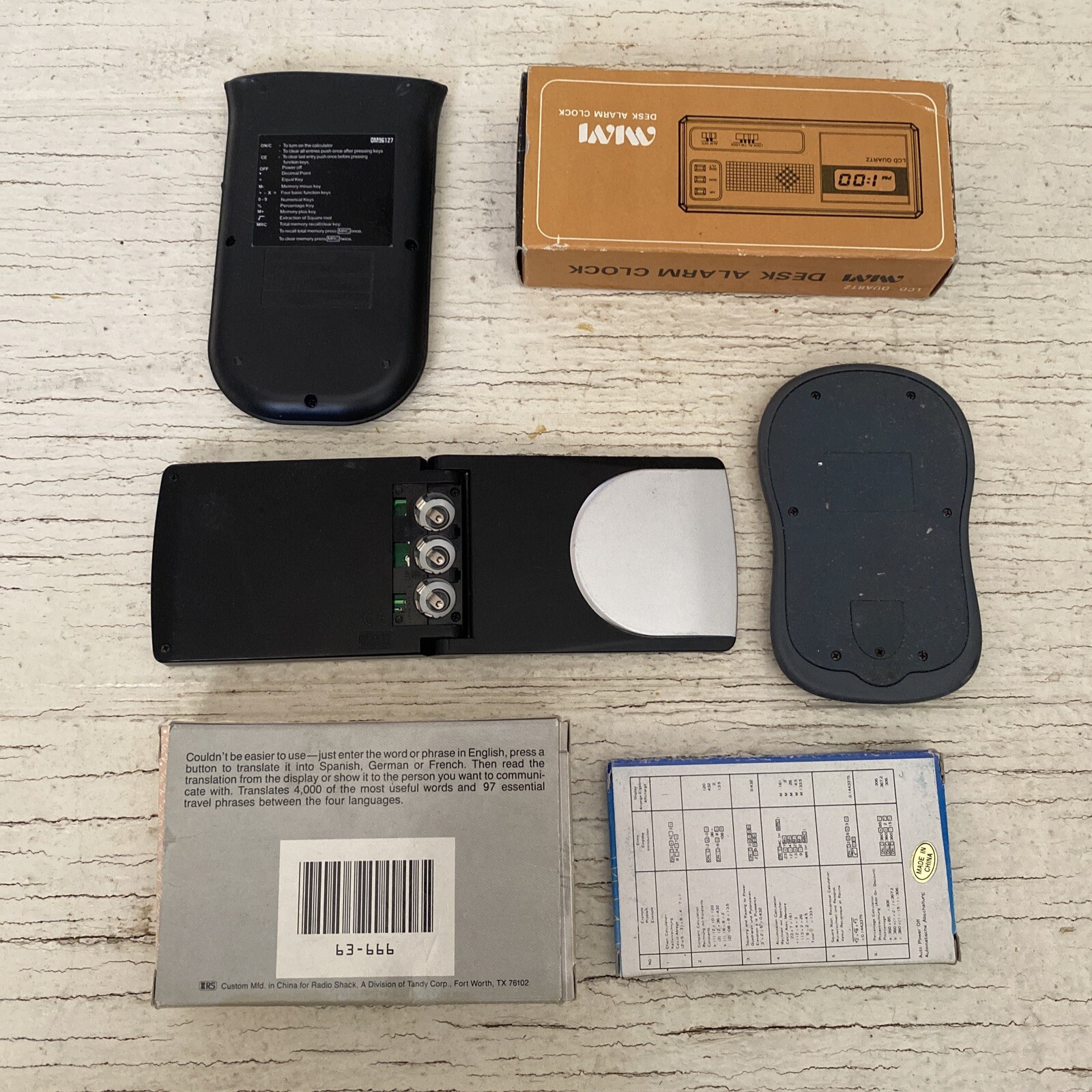 MIXED LOT OF ELECTRONIC USED GADGETS: Alarm Clock, Calculator, Translator, Radio