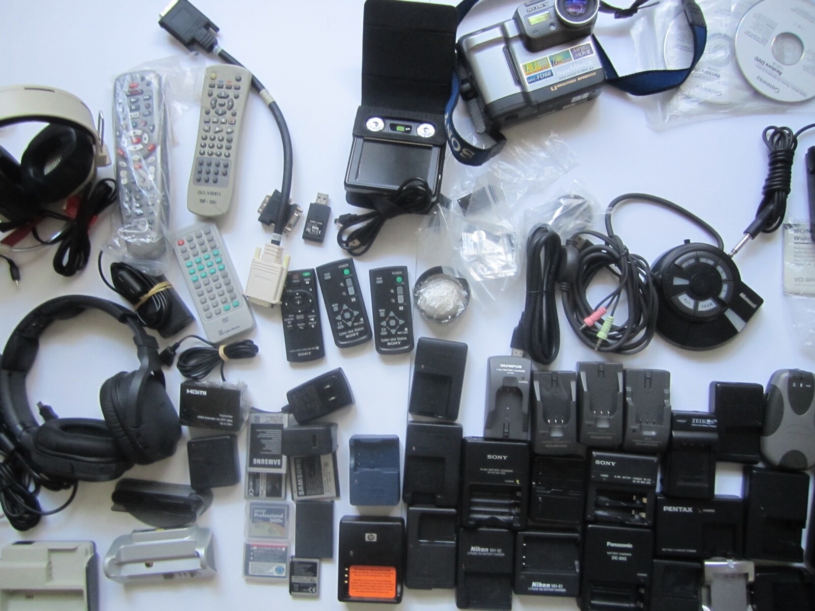 Mixed Lot of Electronics, remotes, battery chargers etc. X