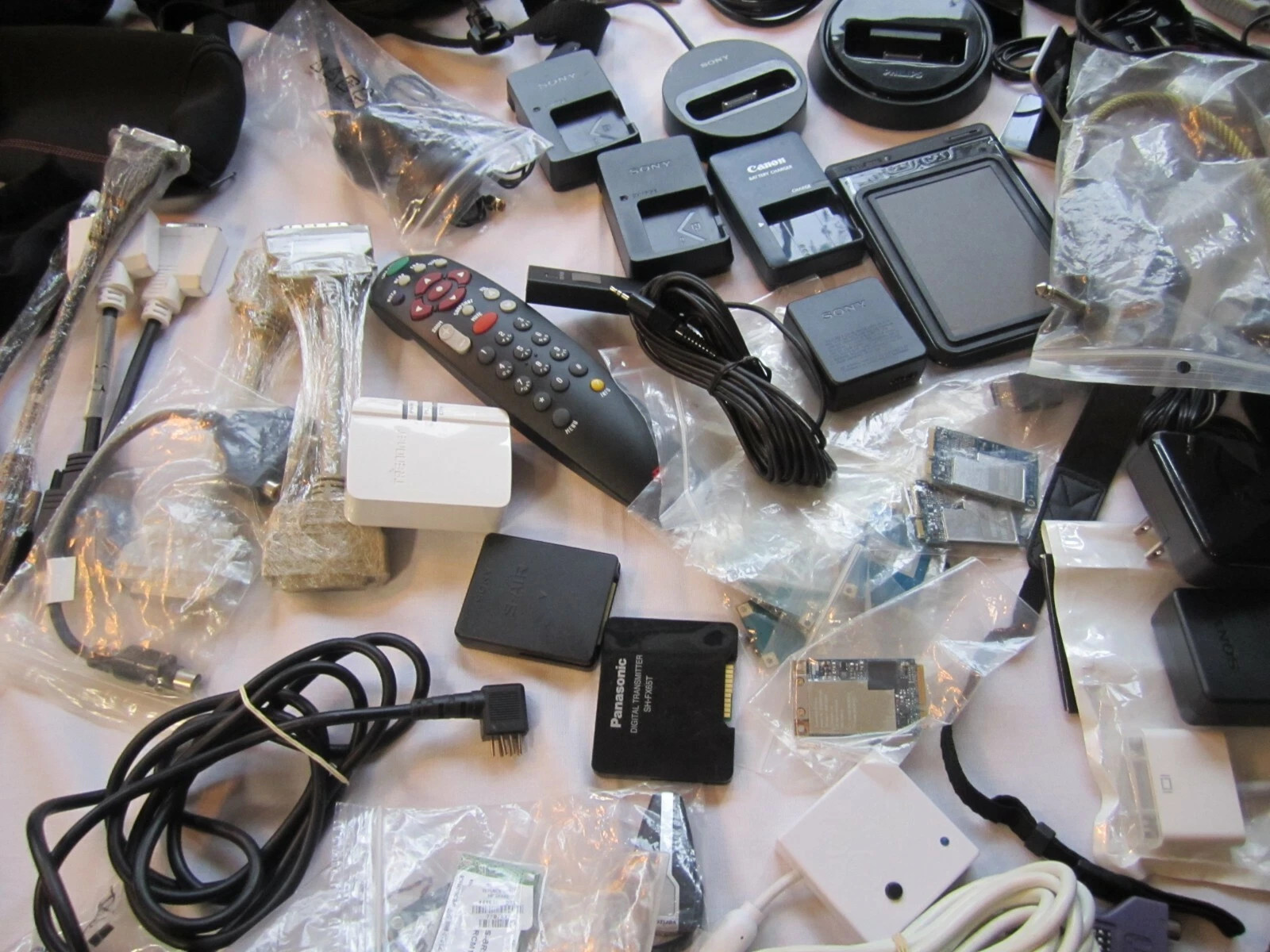 Mixed Lot of Electronics, remotes, battery chargers etc. L