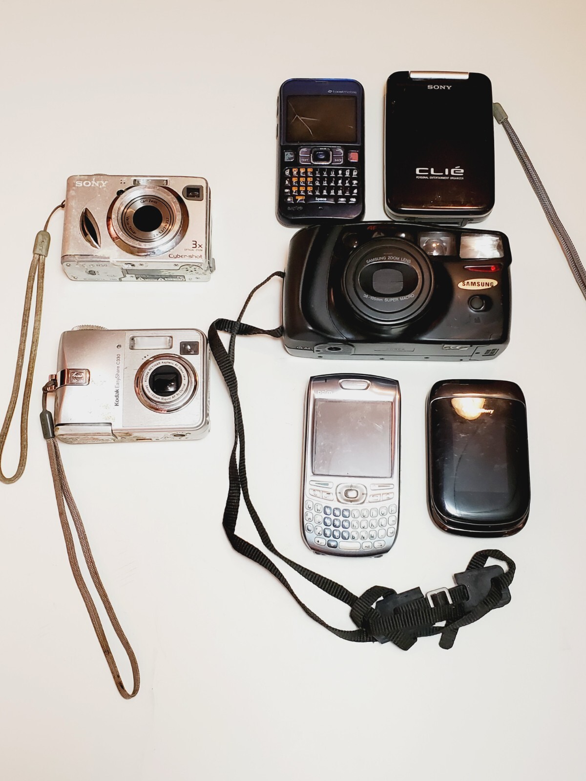 10 Piece Mixed Bundle of Cell Phones and Cameras (For Parts/Most Items Untested)