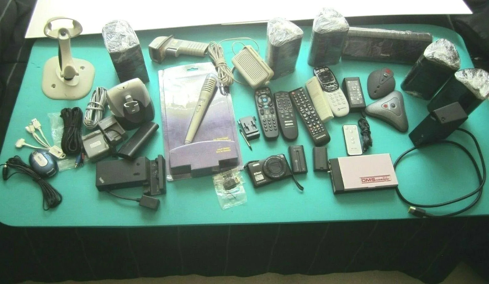 Mixed Lot of Electronics speakers, remote controls, batteries, and more W