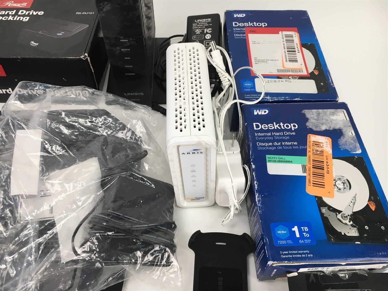 Lot of Headphones Hard Drive Wifi Modem by Linksys Rosewill WD Digipower & More