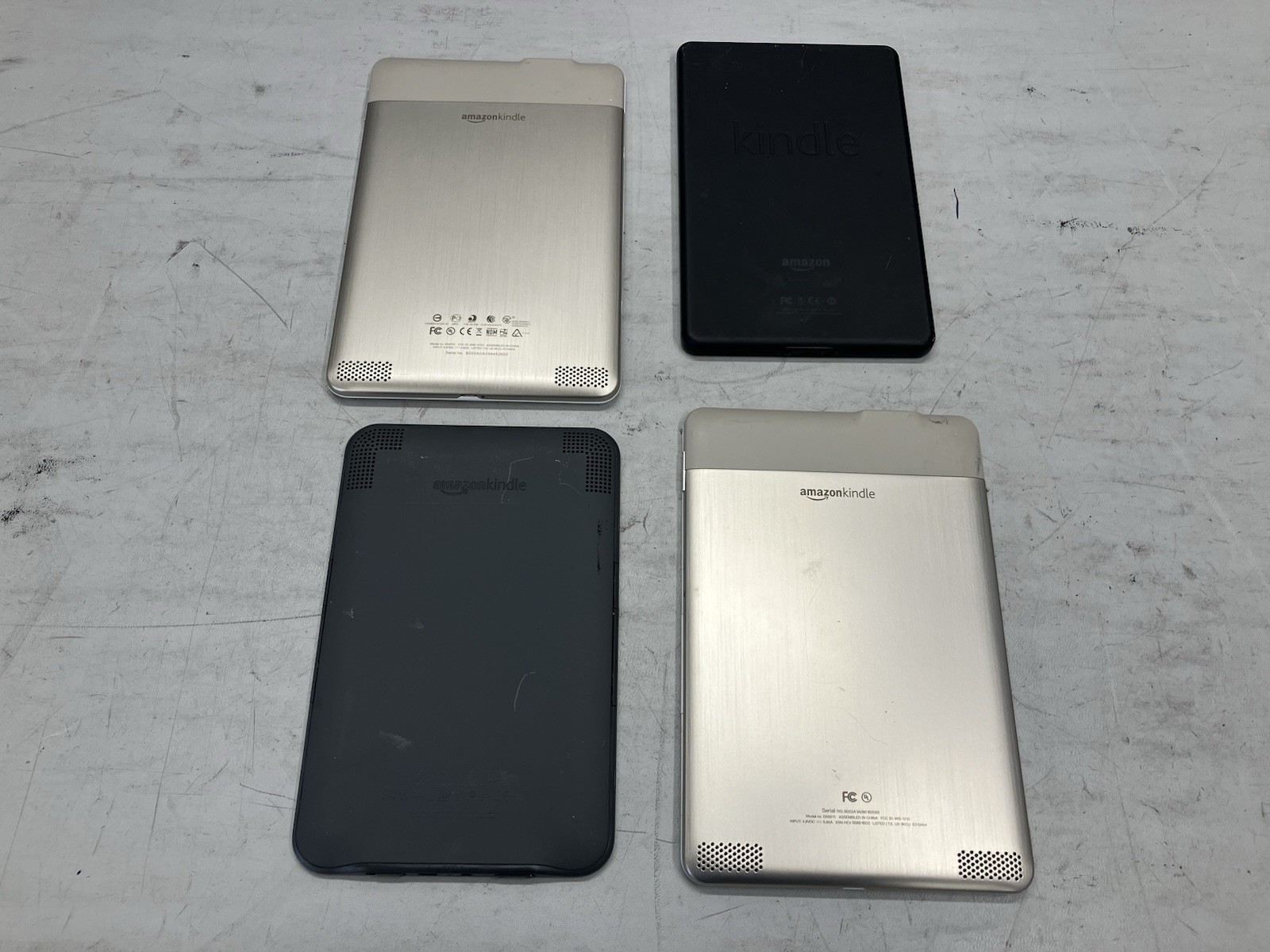 Lot of 4 Amazon Kindles – 2nd Gen x2, 3rd Gen x1, Fire 1st Gen x1