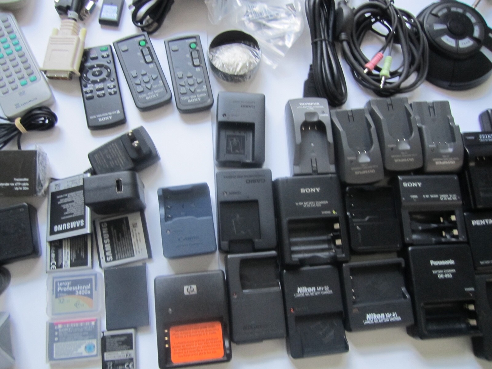 Mixed Lot of Electronics, remotes, battery chargers etc. X